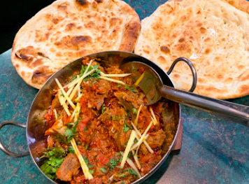 Naan & Kabob signature dishes Chicken Kabob Platter
Naan
Lamb